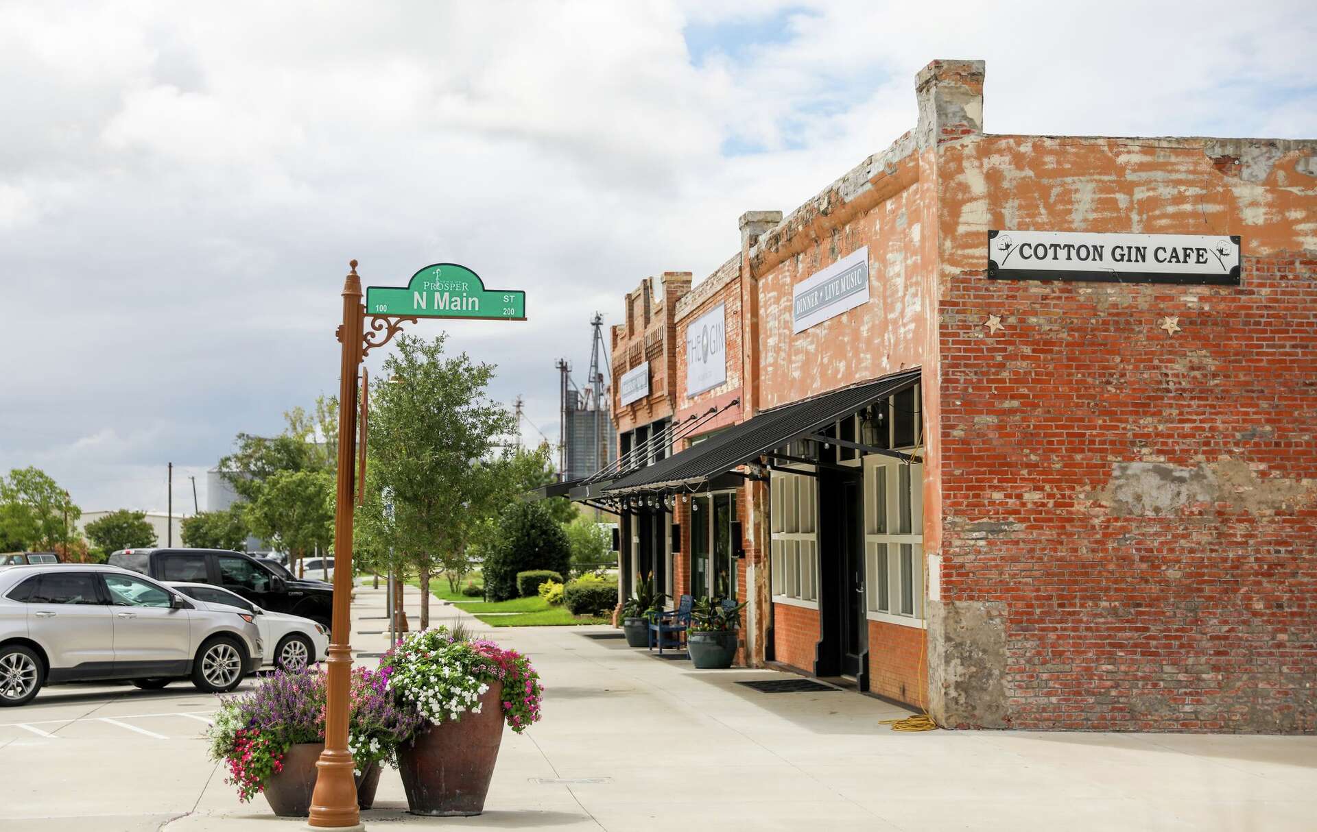Historic storefronts and the Cotton Gin Cafe on Main Street in downtown Prosper, Texas